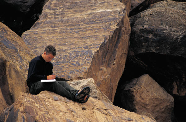 Man Writing in a Journal
