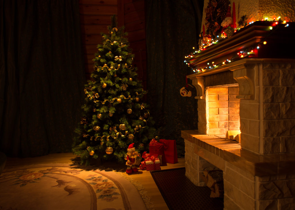 Living room with fireplace and decorated Christmas tree